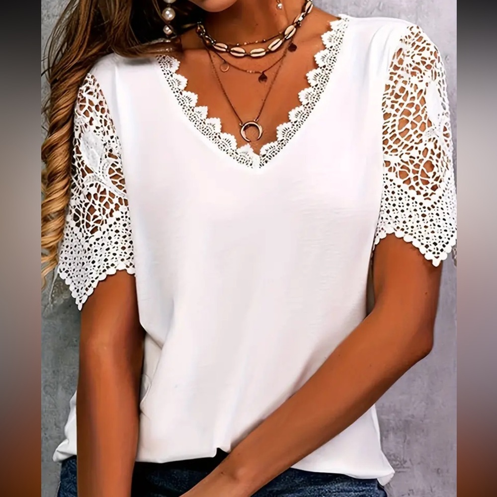 Brand new cute v-neck t-shirt with lace panels.